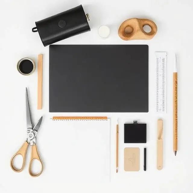 A minimalist flat-lay of design tools, indicating a thoughtful and curated process.